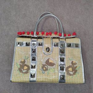 Betseyville by Betsey Johnson Faux wicker with red pom poms